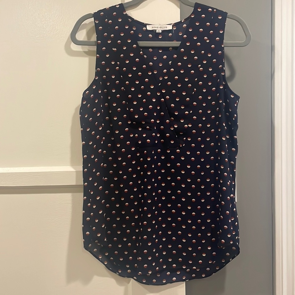 Blue tank top with red and white polka dots